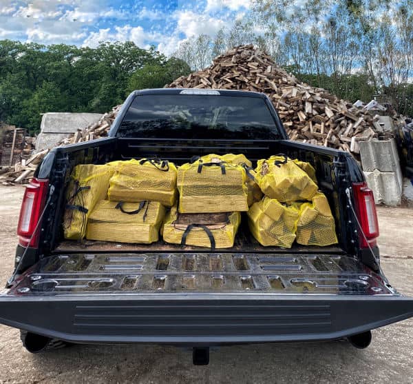 Image of a pickup truck full of bags of firewood in Lake in the Hills
