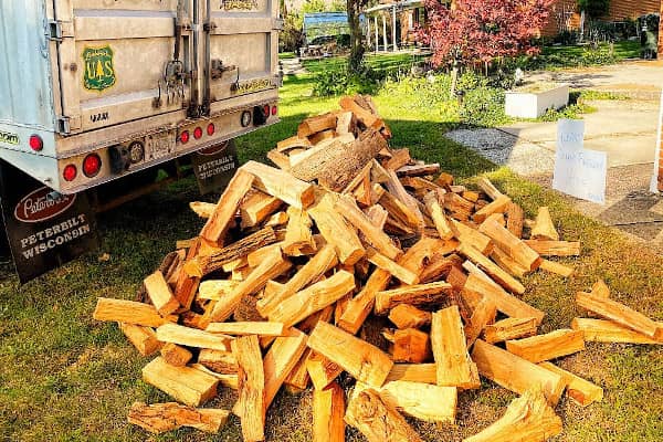 A pile of kiln-dried firewood delivered to a residence