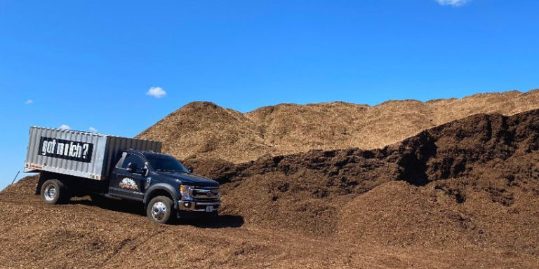 A Lumberjacks truck collecting mulch for delivery in Woodstock, IL