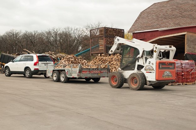 Customer picking up firewood from Lumberjacks