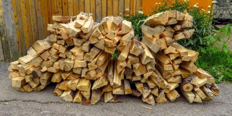 Bundled firewood sitting in a driveway