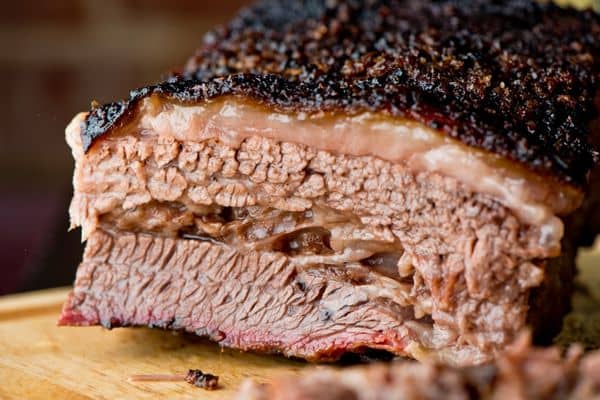 Barbecue beef brisket on a wood cutting board