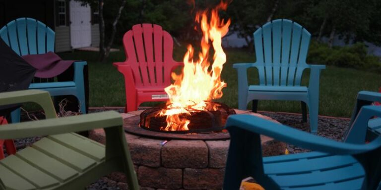 A fire pit surrounded by chairs