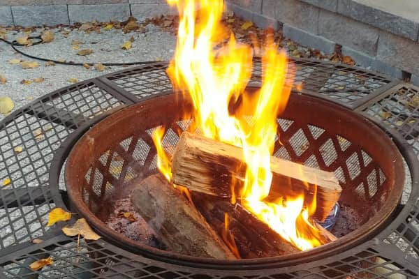 Kiln-dried firewood burning in a fire pit