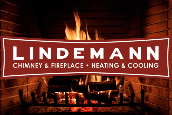 Logo for Lindemann in front of a roaring fireplace