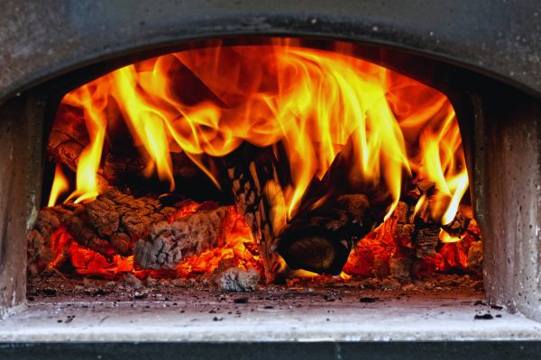 Cooking wood is burning in a stove