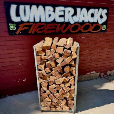 Photo of The Jack Stack prior to delivery with the Lumberjacks Firewood banner in the background.
